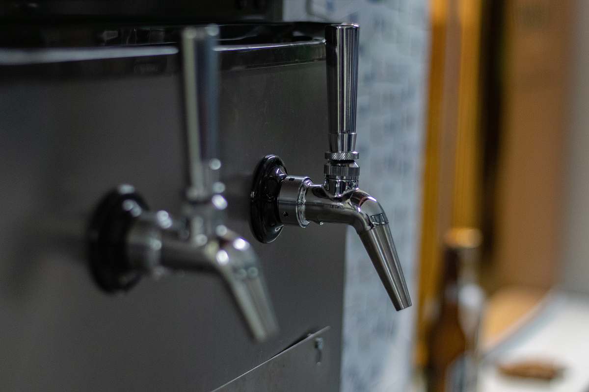 indoors selective focus photography of gray faucets sink faucet