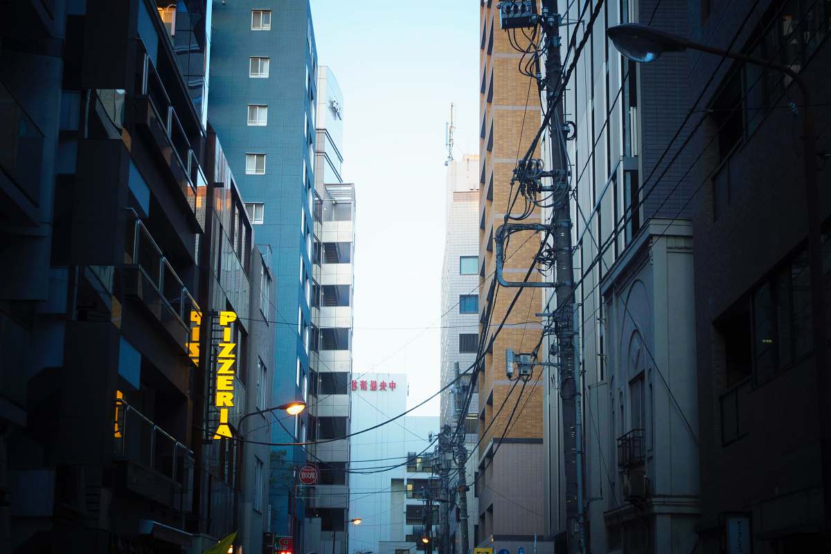 building yellow LED sign in city near road city