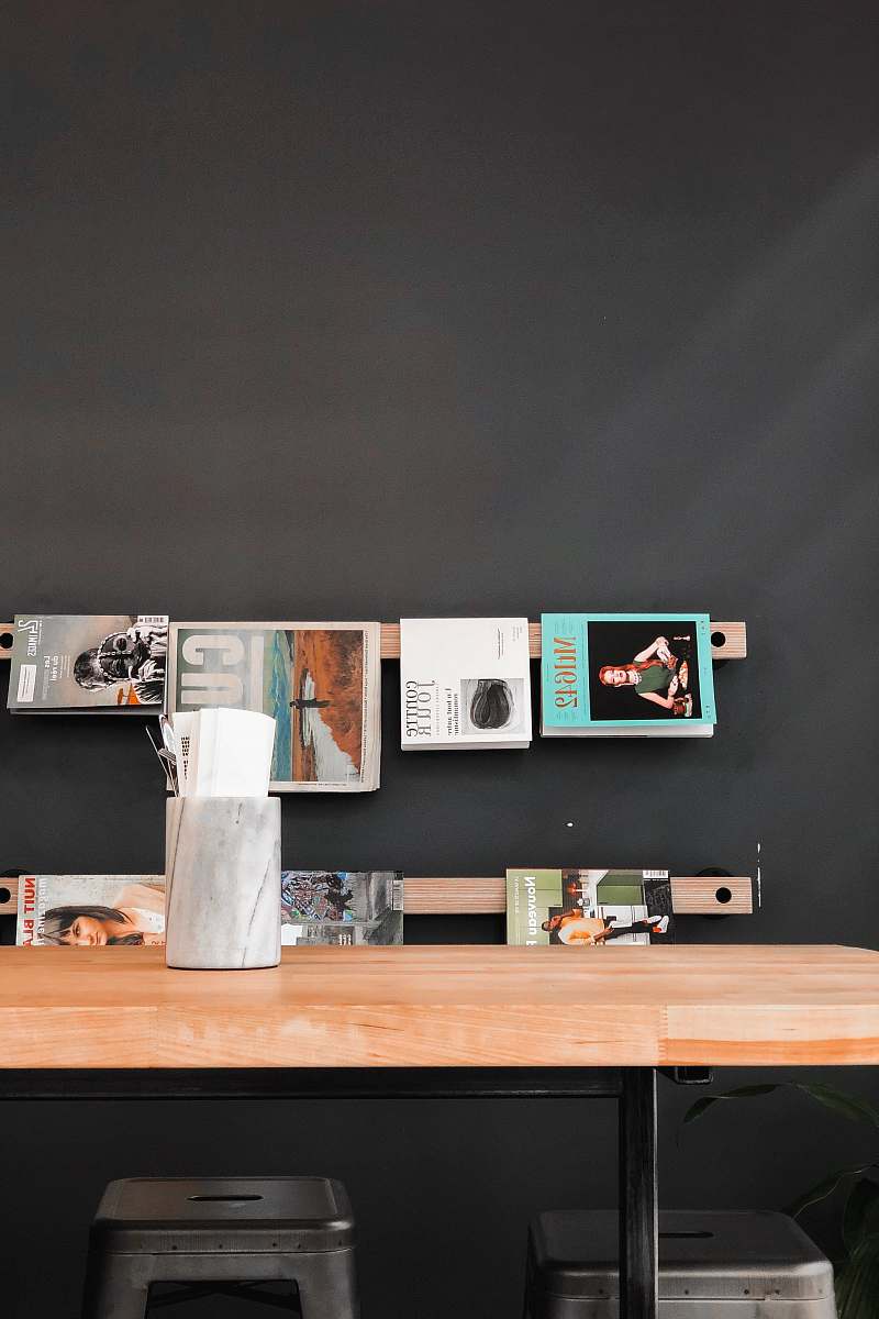 furniture books and magazines hanged over wooden table tabletop