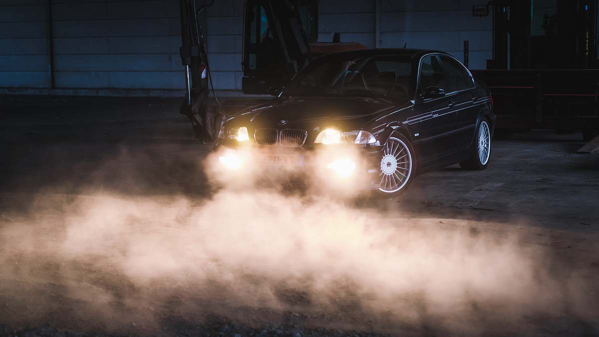 car parked car with smoke automobile
