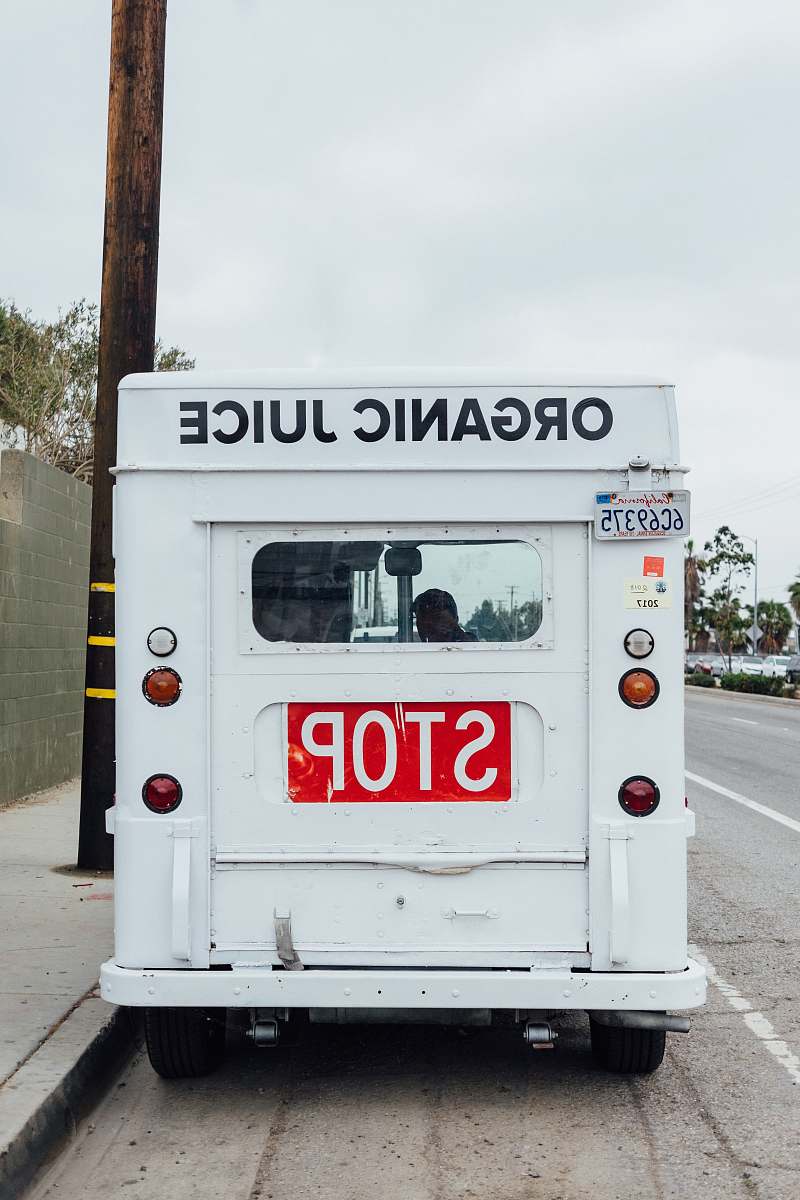 vehicle parked white van bus