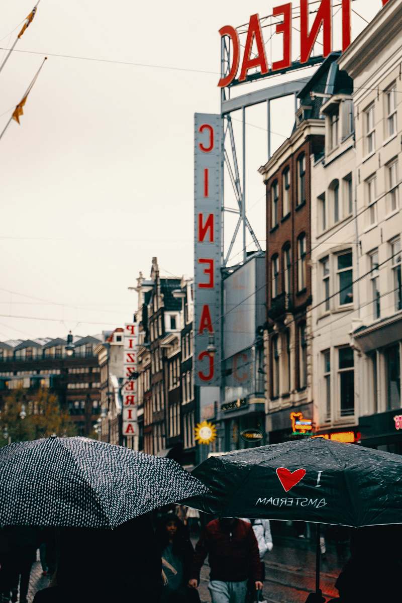 canopy Cineac signage beside grey concrete building amsterdam