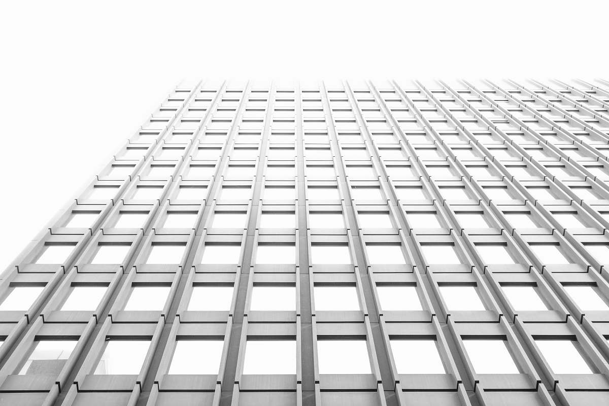 black-and-white gray concrete high-rise building office building