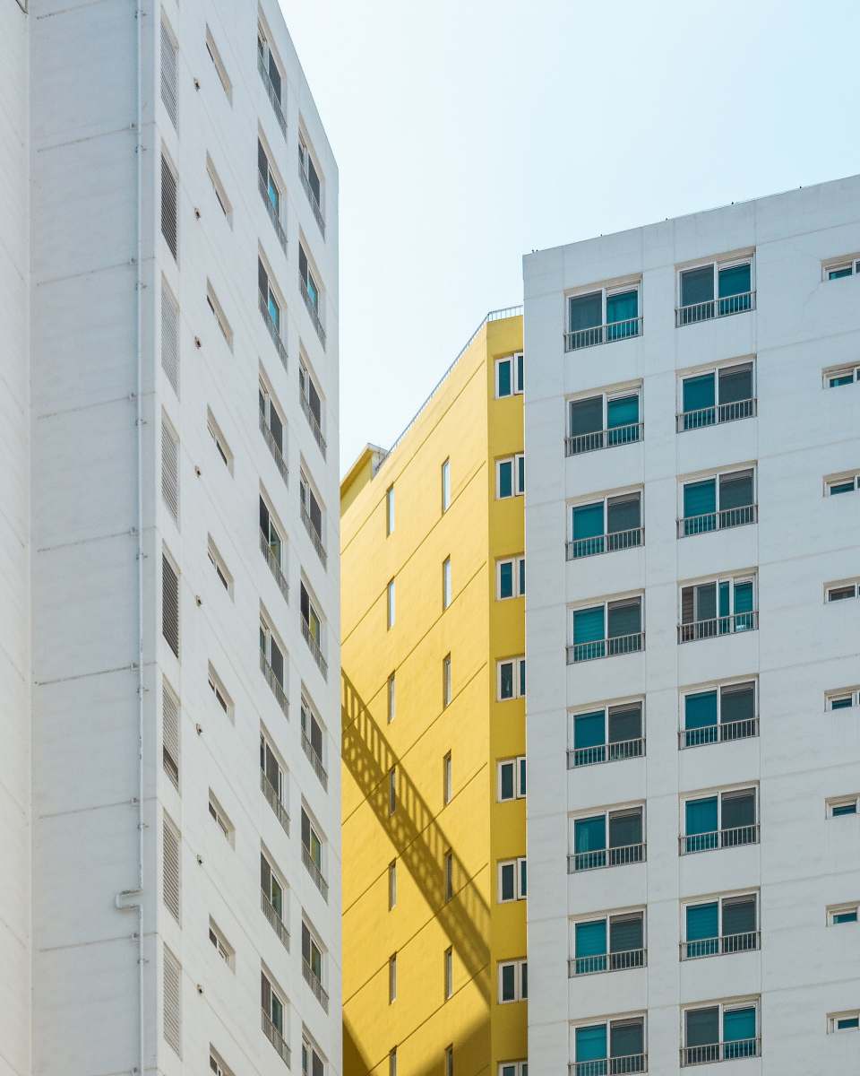 building white and yellow buildings city