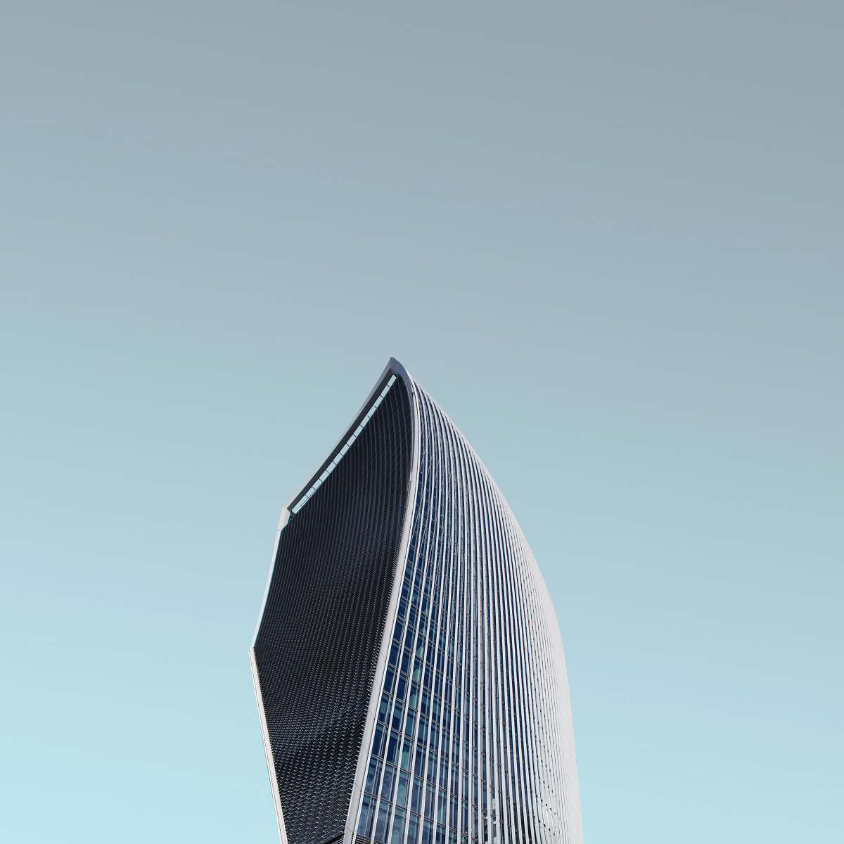 city worm's eye view photography of glass tower building