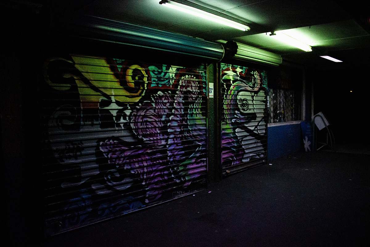 lighting dimmed lighted alley with graffitis art