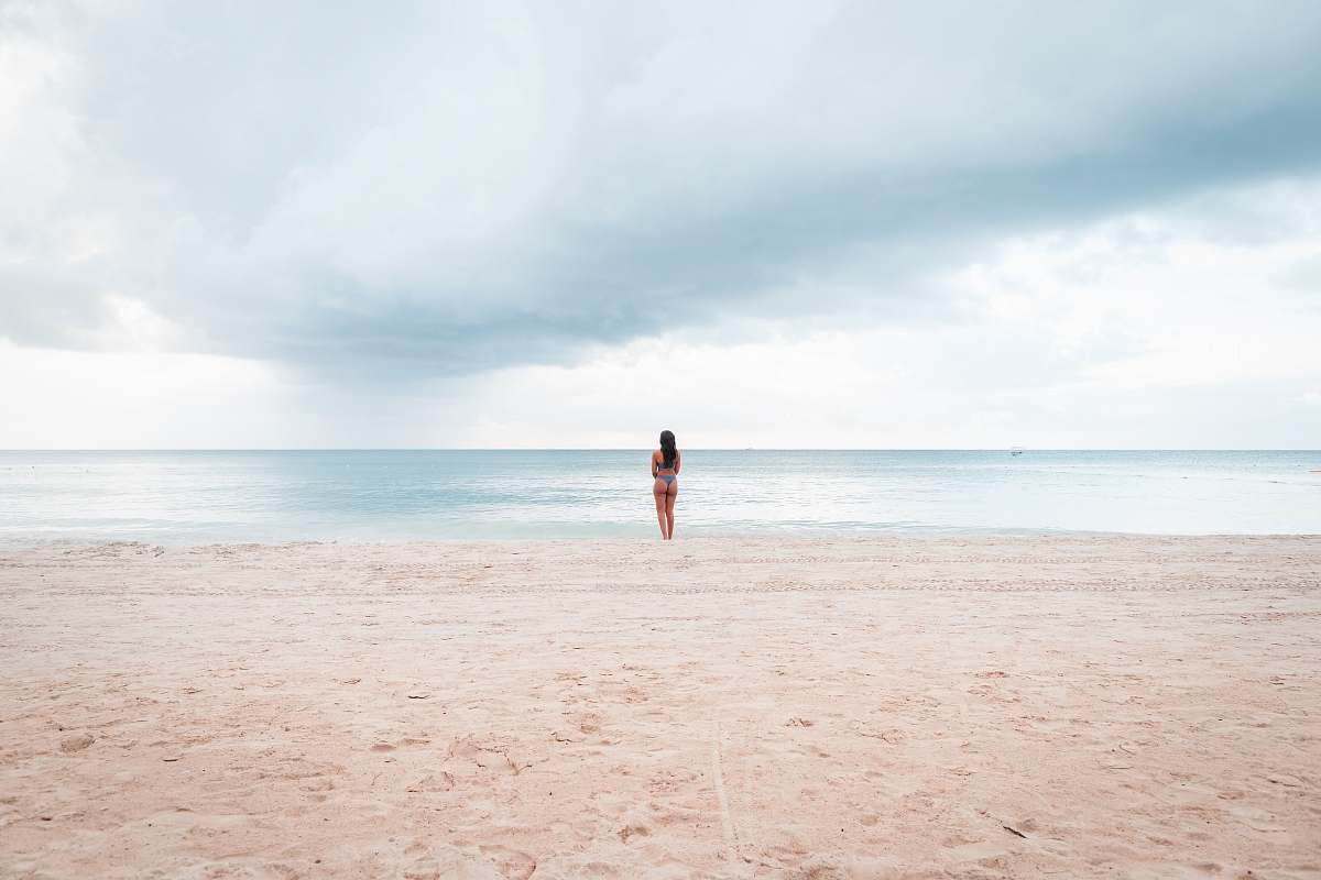 nature person standing on seashore during daytime outdoors