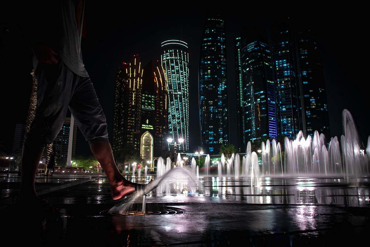 fountain water fountain in front of building during nighttime human