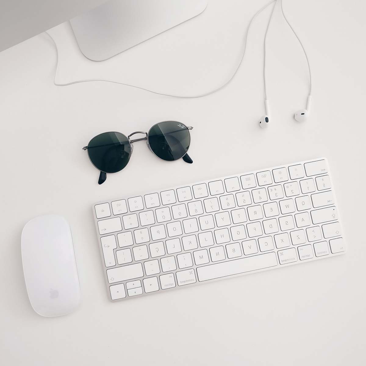 desk Apple Magic keyboard and mouse white