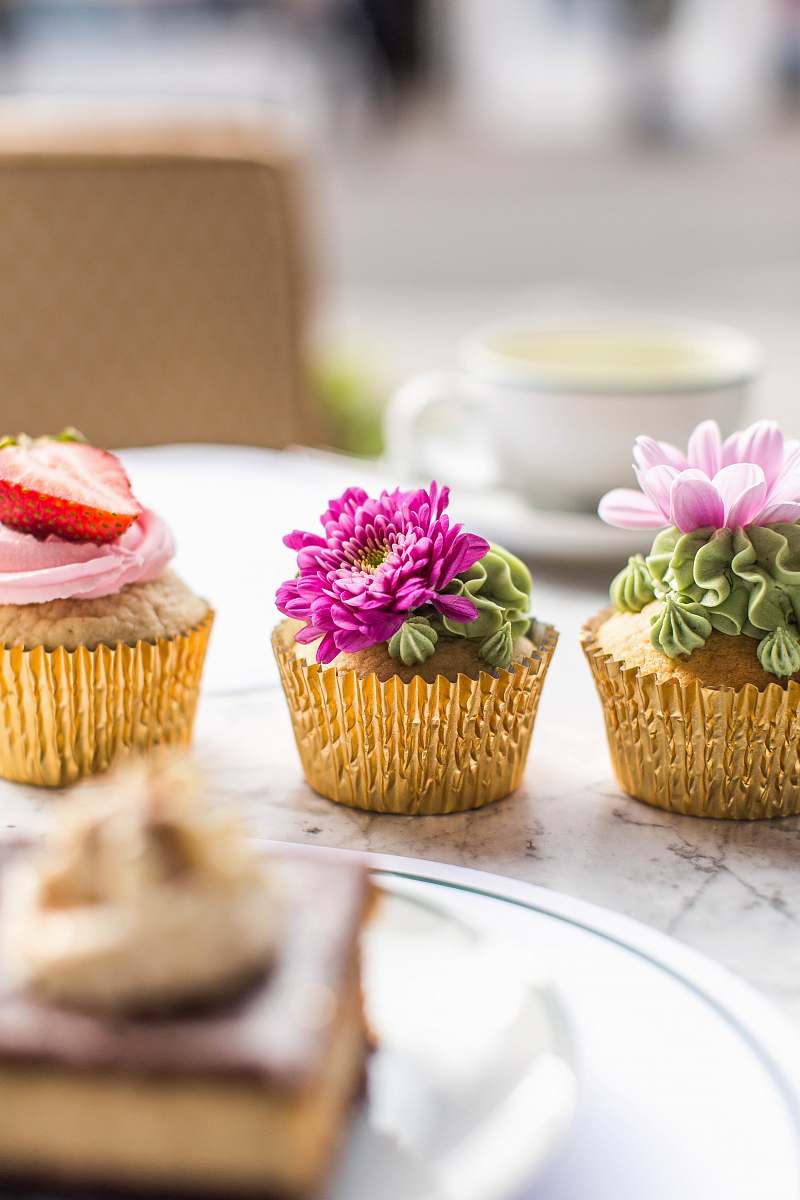 Indulge in the delightful presentation of three beautifully decorated cupcakes arranged on an elegant plate. This vibrant image captures the sweet allure of these tasty treats, making it perfect for bakery promotions, dessert recipes, or party invitations. Whether you're a food blogger, event planner, or simply looking to add a touch of sweetness to your project, this captivating scene will elevate your content.