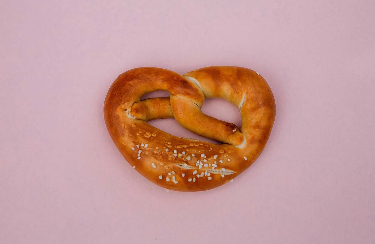 food bread knot on pink surface cracker