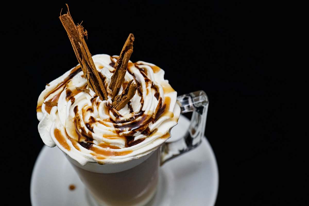 creme clear glass mug with whip cream on top dessert