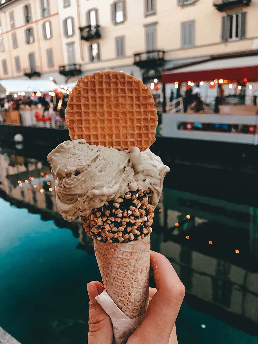 creme coffee flavor ice cream with waffle and sprinkles in cone cream