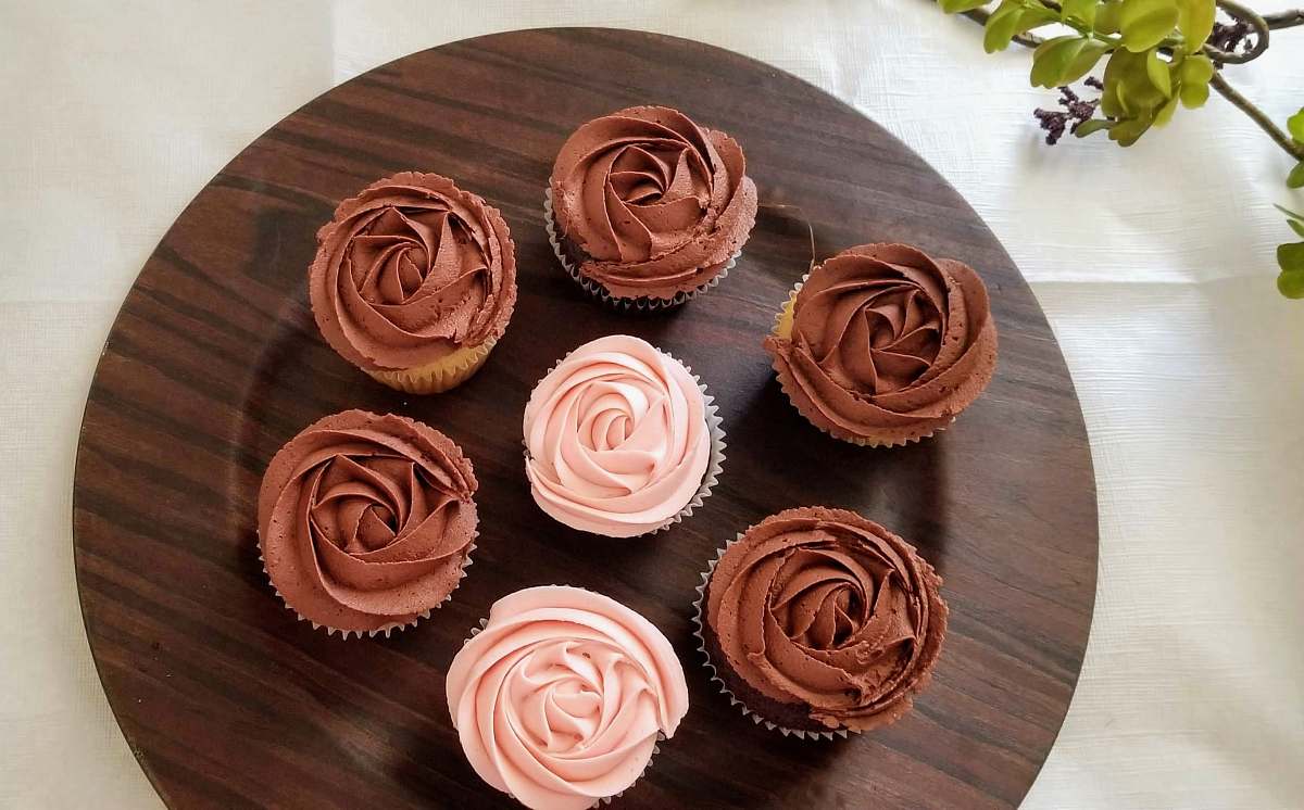 cream cupcakes on table creme