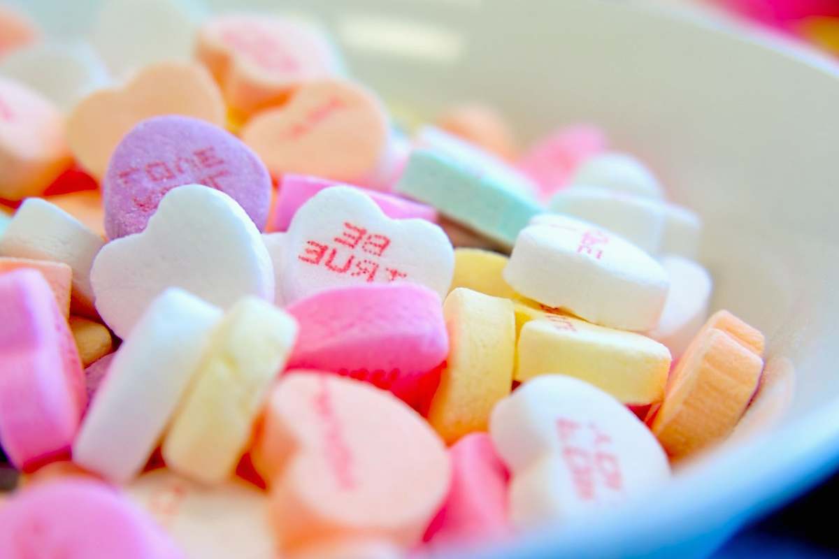 candy assorted hear-shape candies on white bowl sweets