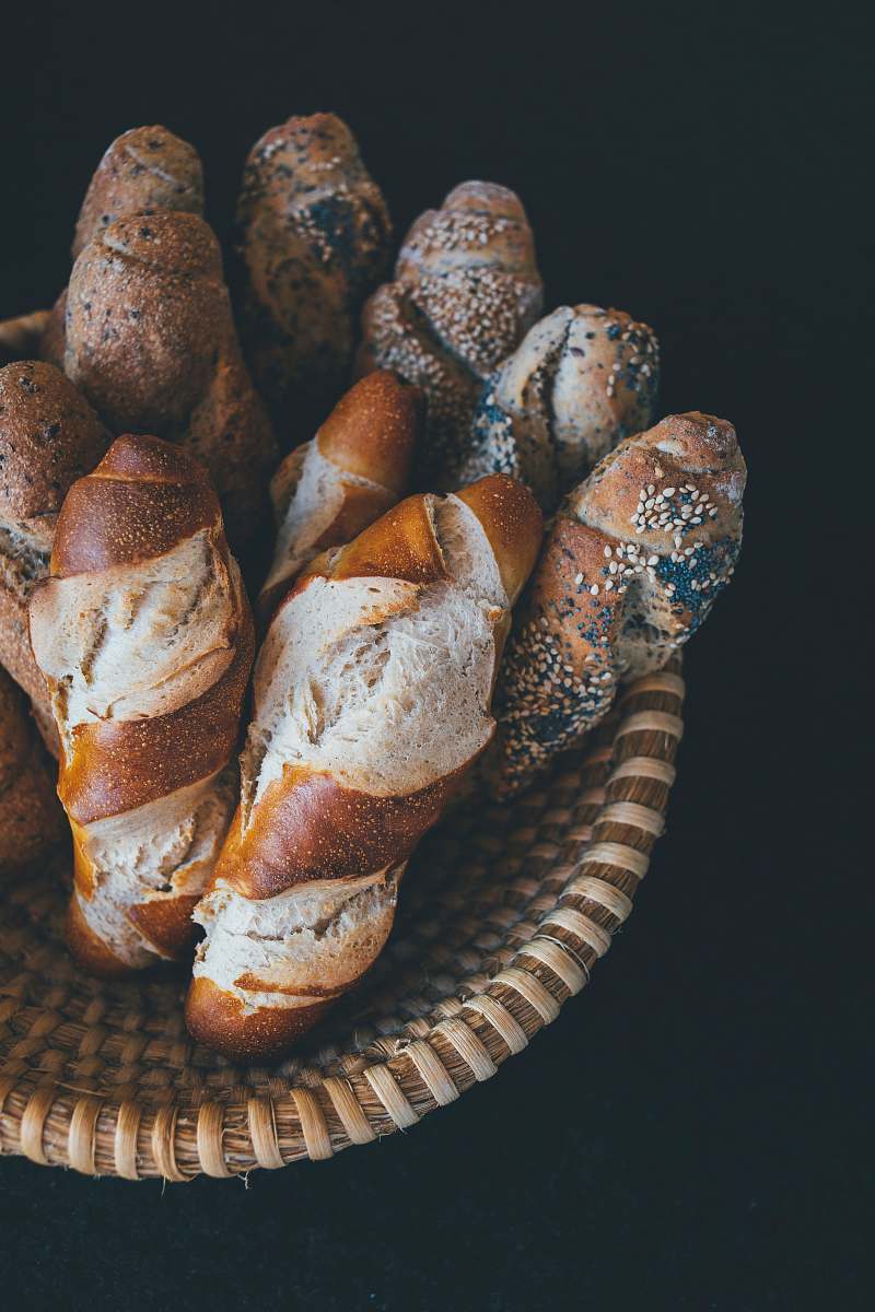 bread baked bread on brown wicker bowl bun