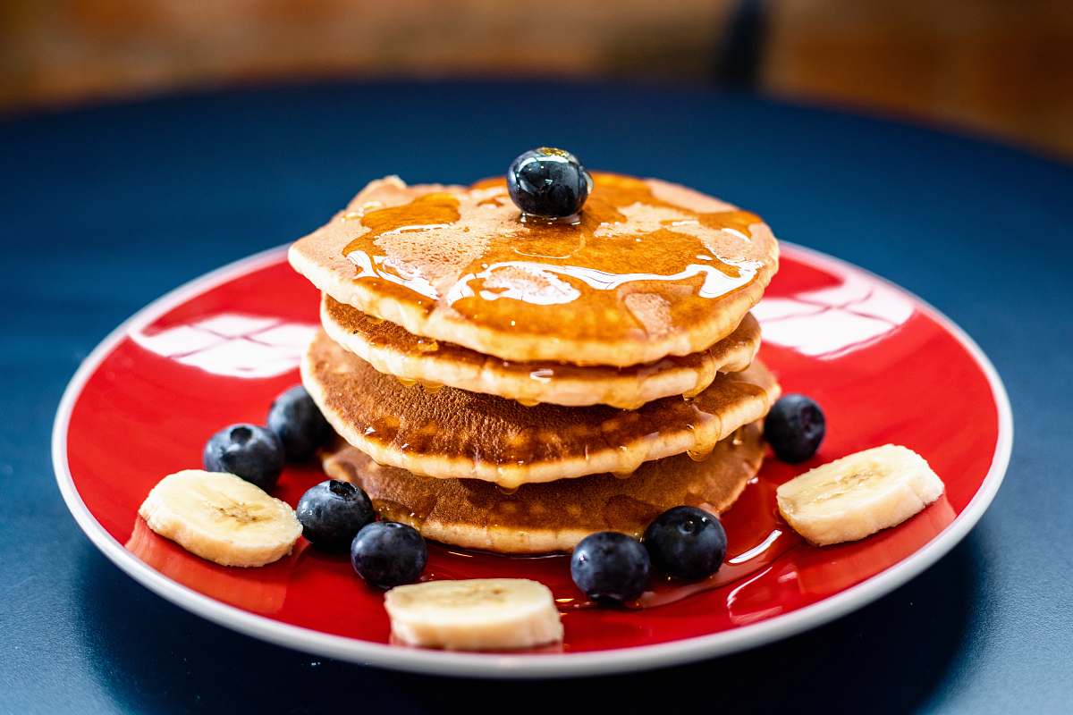 pancake baked pancake with blueberry and slice of banan bread