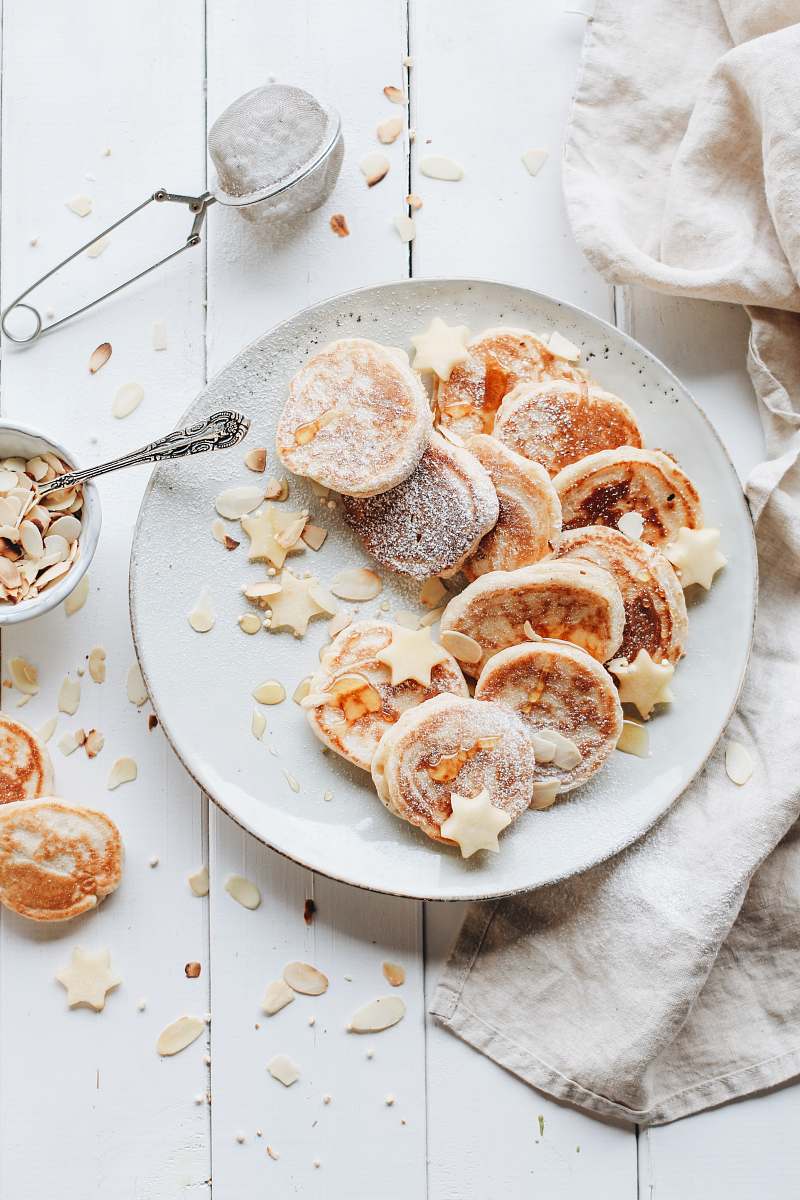 dessert biscuits on plate beside towel pastry