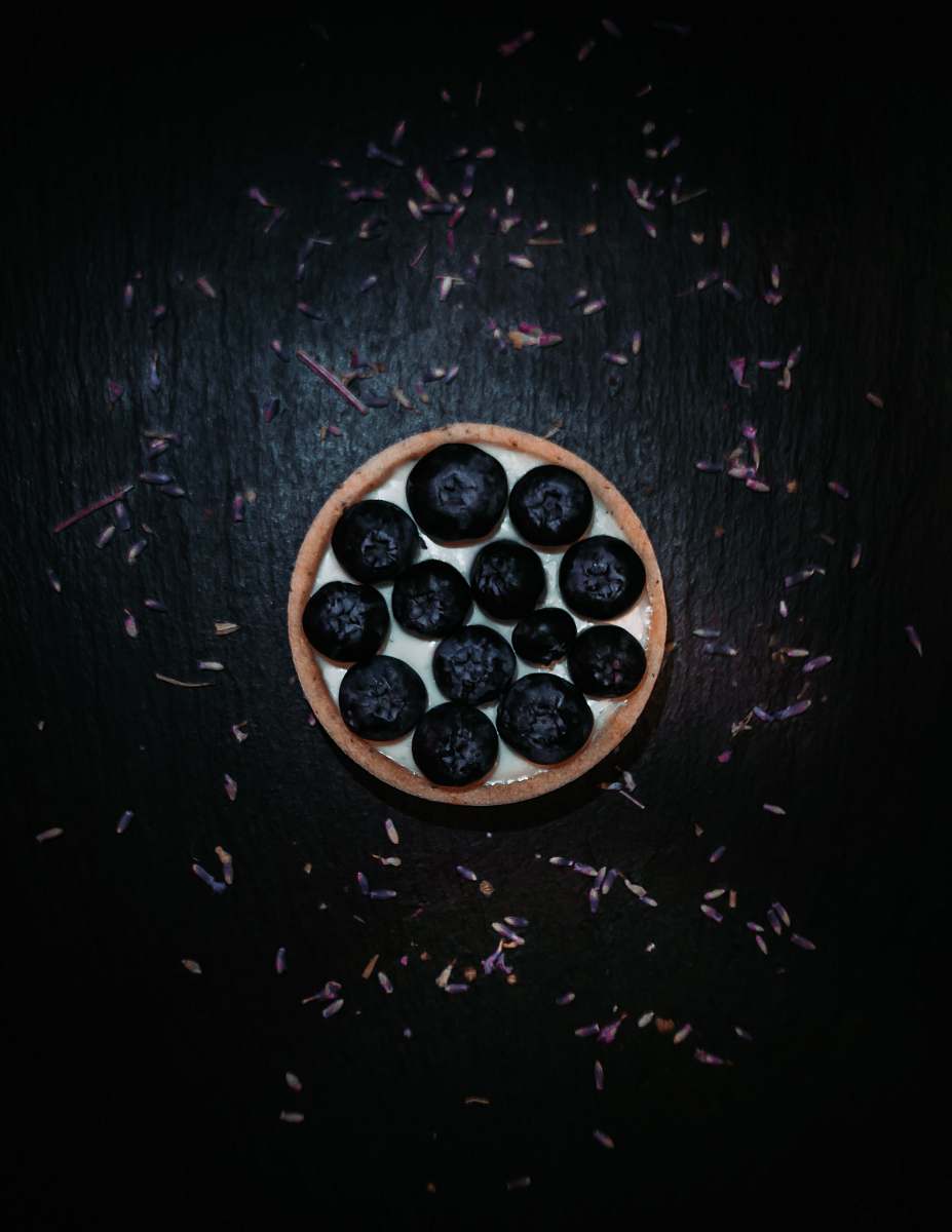blueberry black berries in white and brown round tray fruit