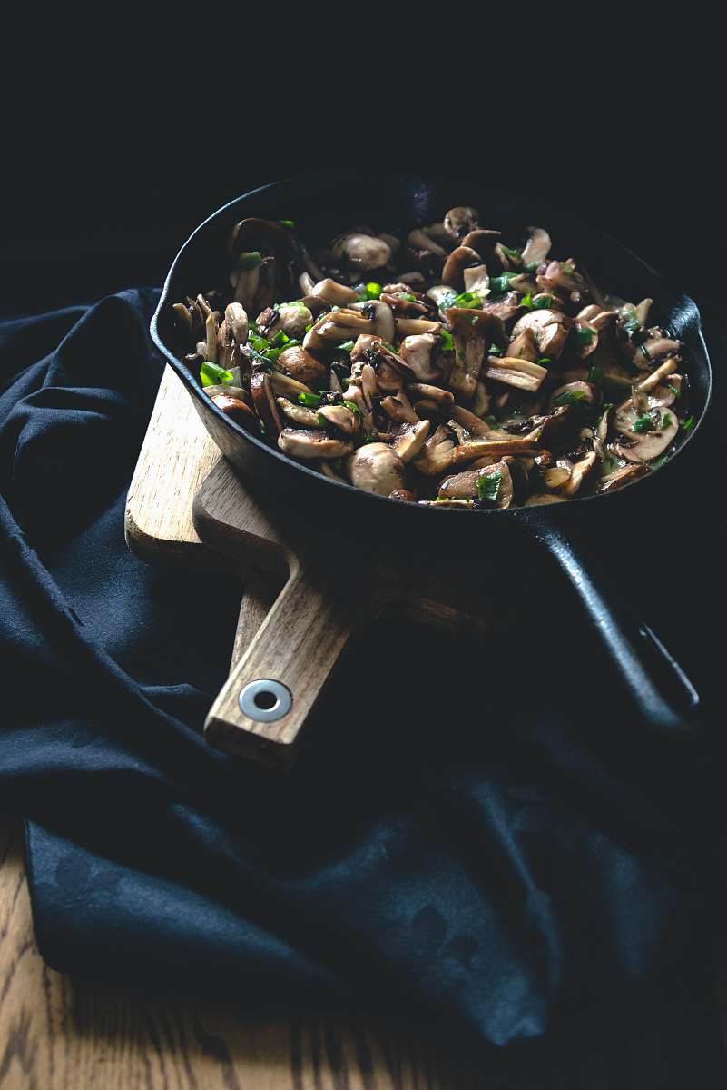 plant black frying pan with food on top bean sprout
