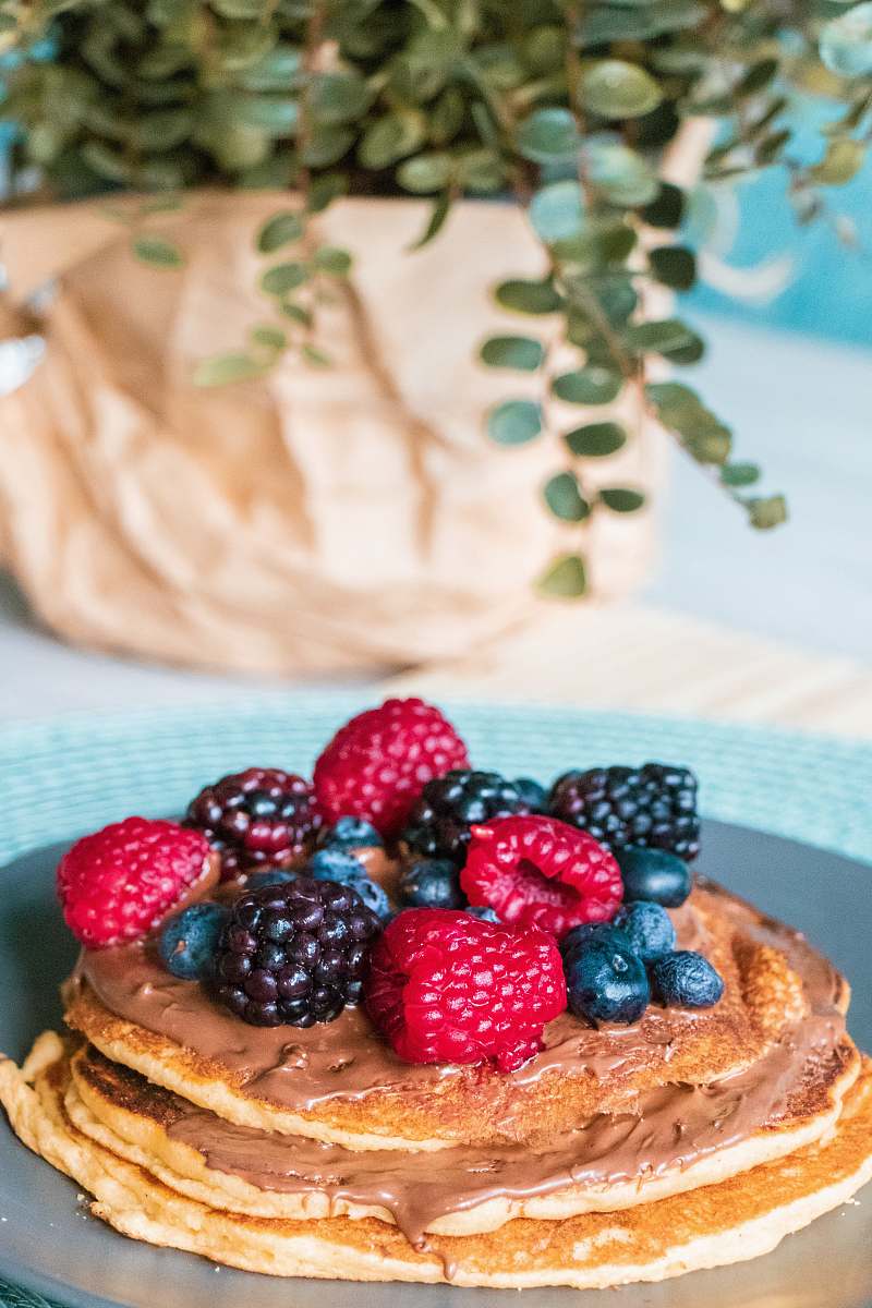 bread blackberries, raspberries, and blueberries on pancake plant