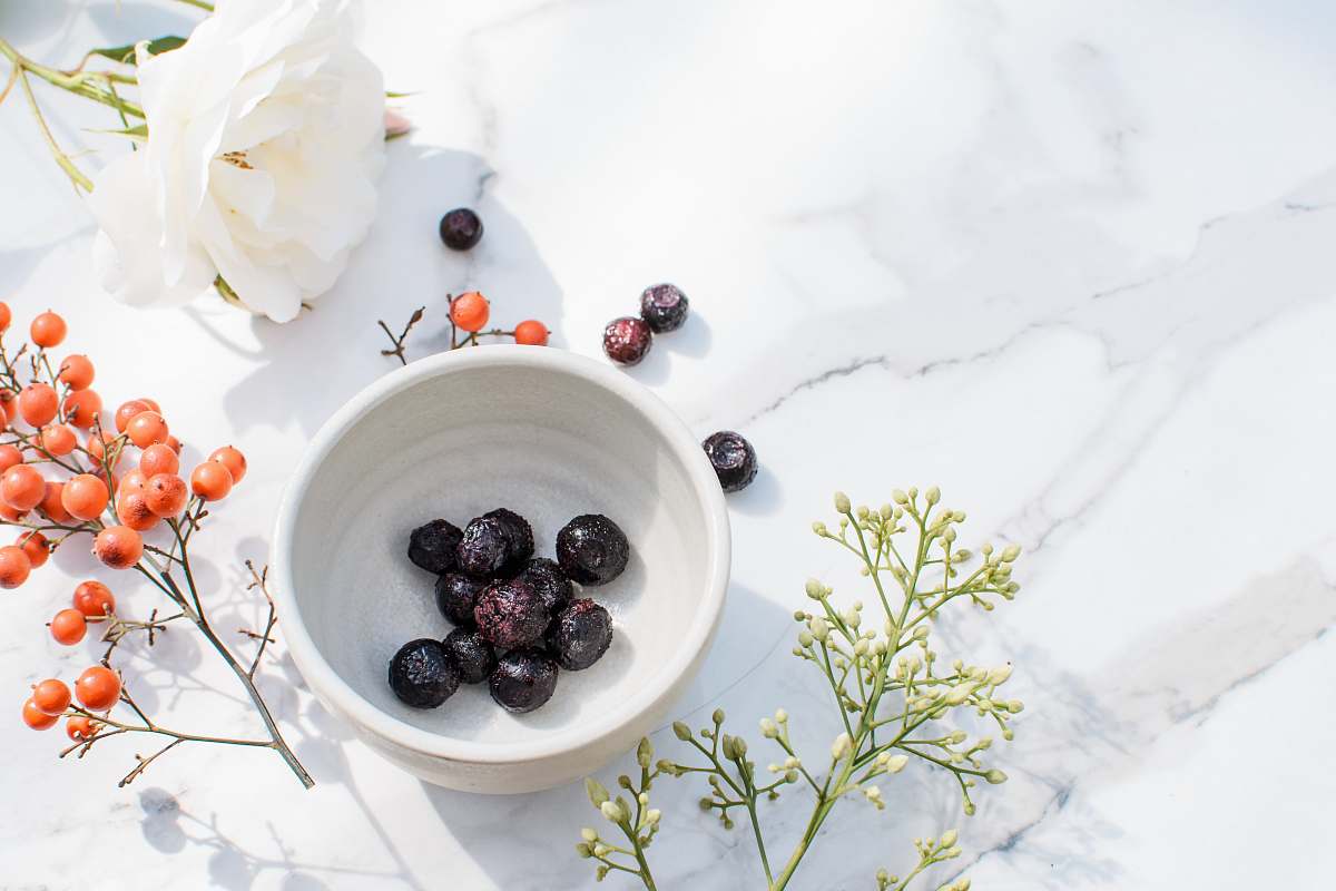 plant blue berries on white ceramic bowl blueberry