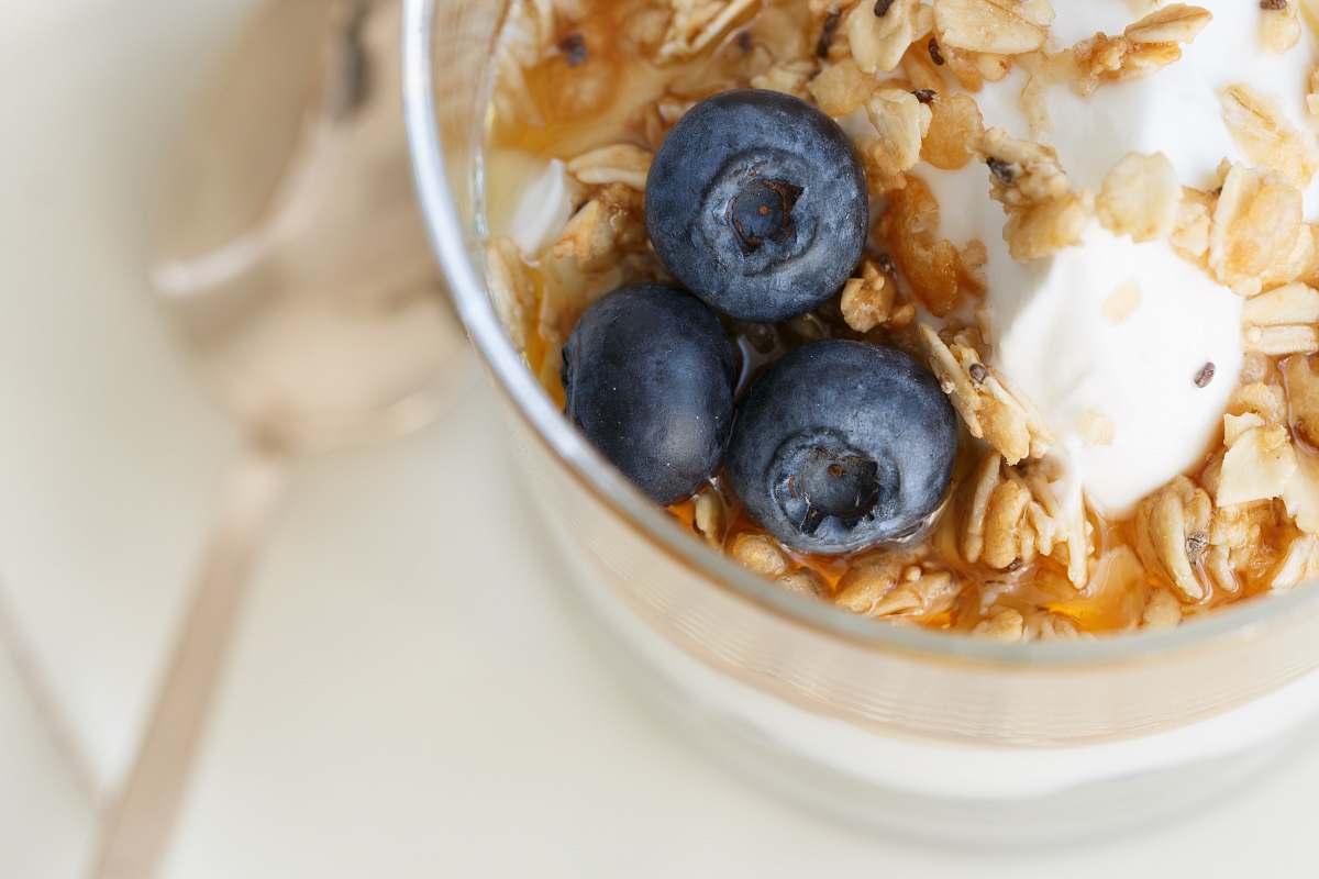 plant blue berry on clear glass bowl fruit