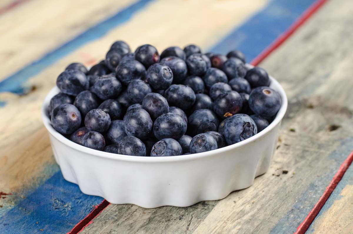 fruit blueberries on white ceramic bowl blueberry