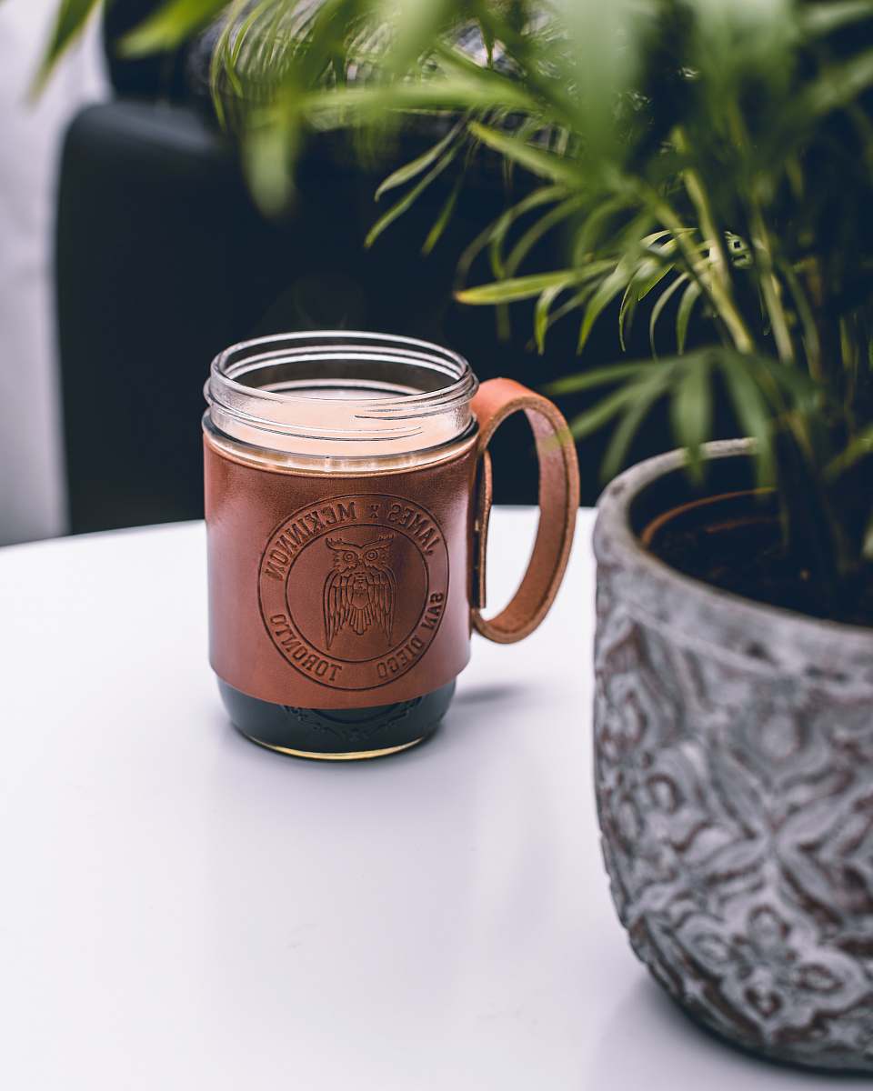 drink brown and clear glass mug on white surface beverage