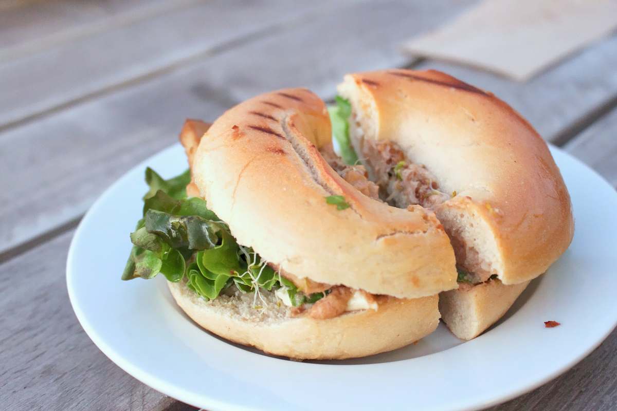 bread burger on white ceramic plate bagel