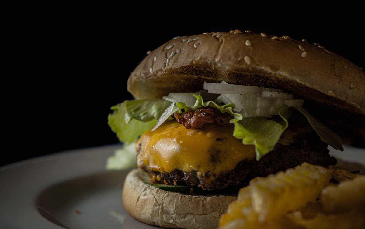 burger burger with lettuce, cheese, and ham yummy