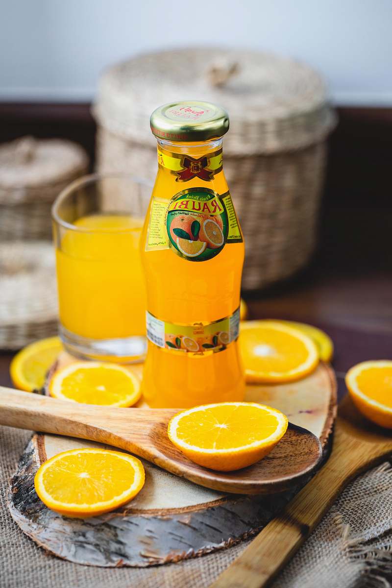 orange clear glass bottle citrus fruit