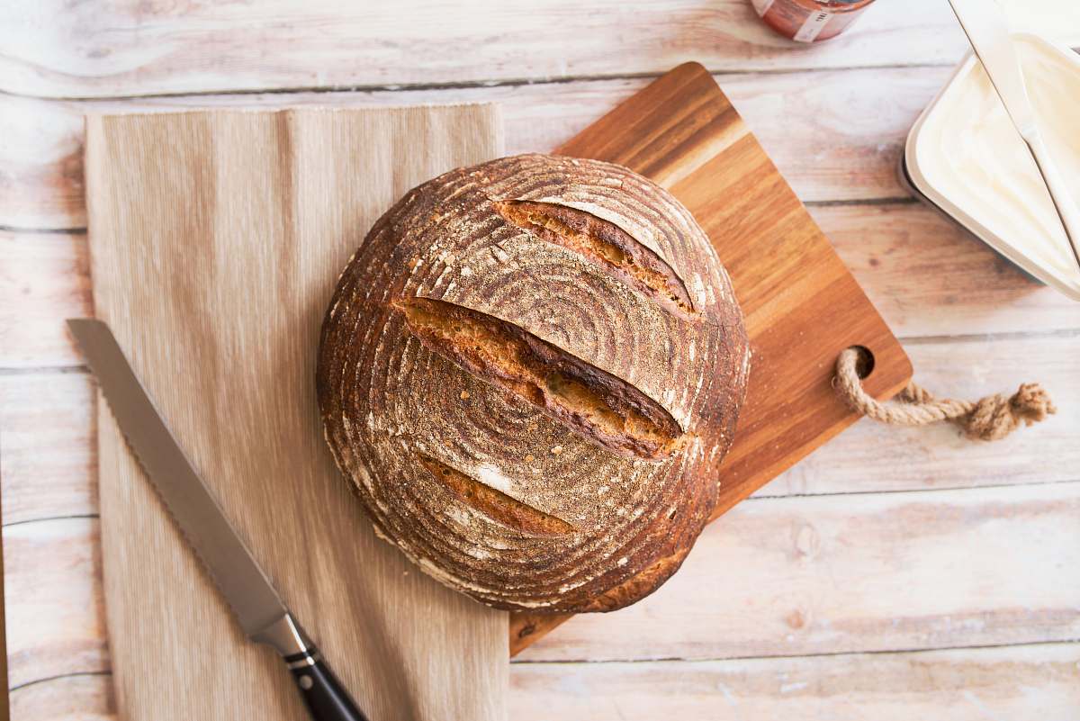 bread closeup photo of baked bread on chopping board bakery