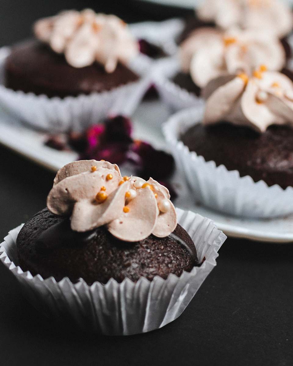 cream closeup photo of cupcakes with icing on top dessert