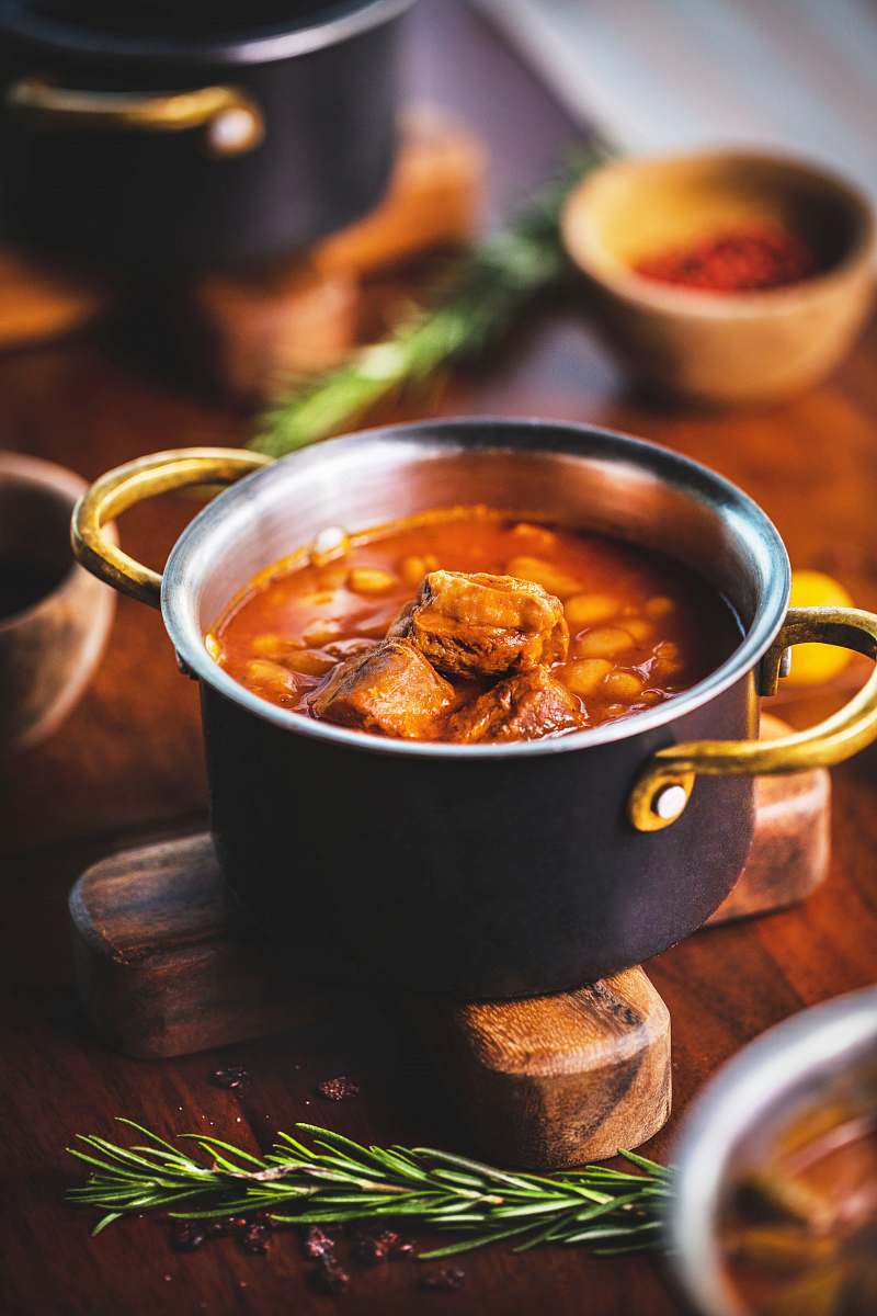 bowl cooked dish in black cooking pot dish