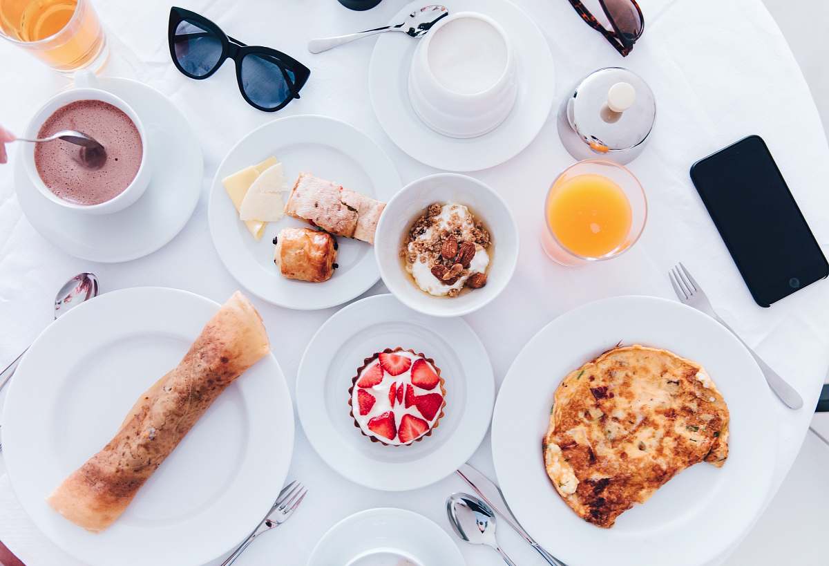 breakfast cooked food on ceramic plates meal