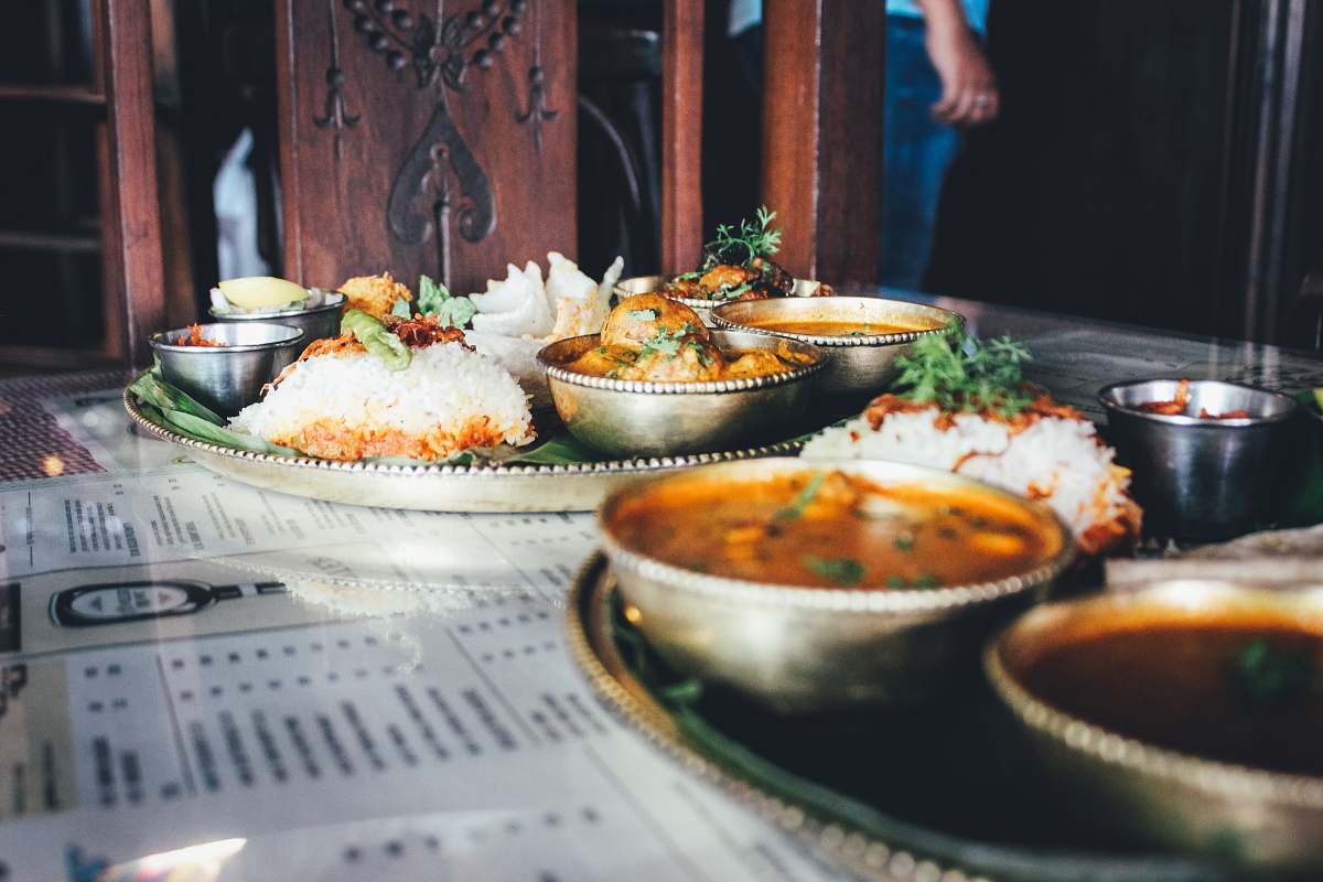 meal cooked rice and different foods in bowl on table restaurant