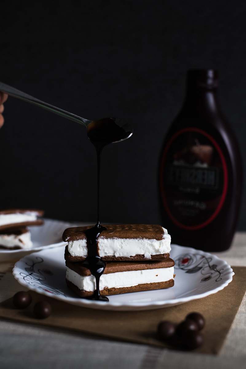 dessert cookies with cream and chocolate sauce on top of plate chocolate