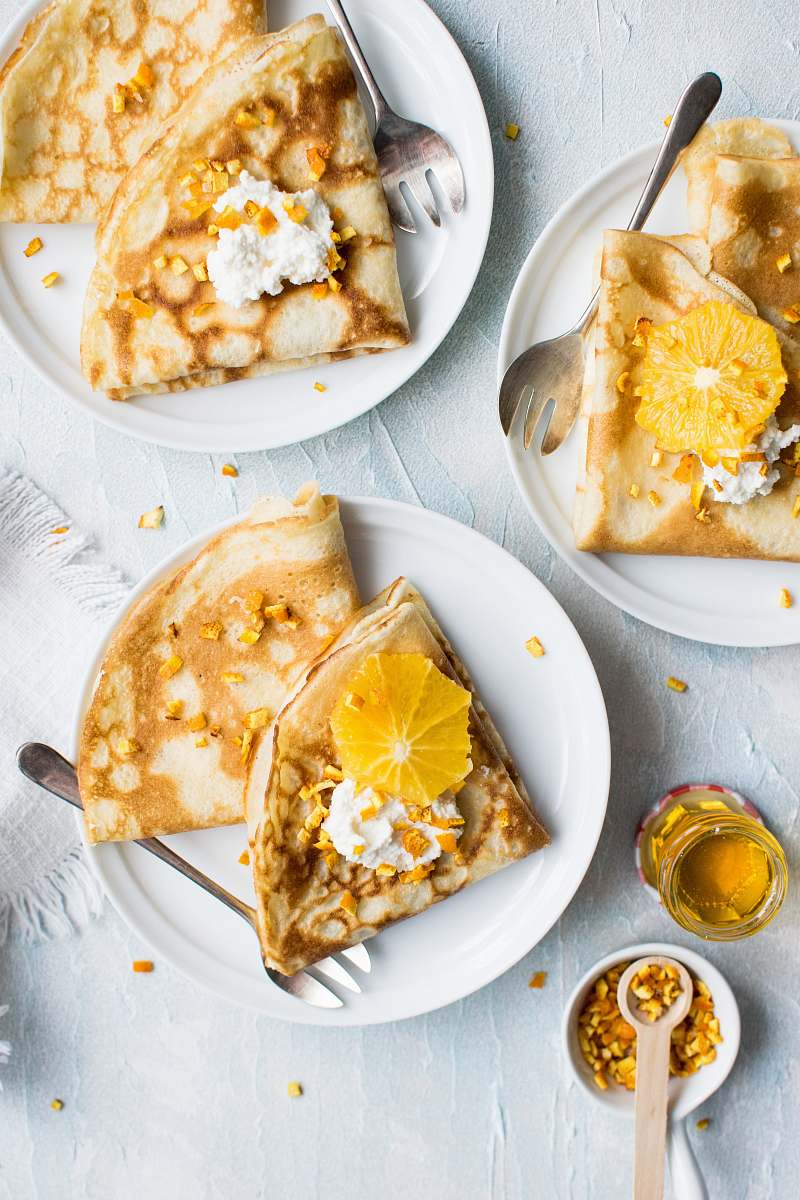 honey flat-lay photography of pancake with icing cutlery