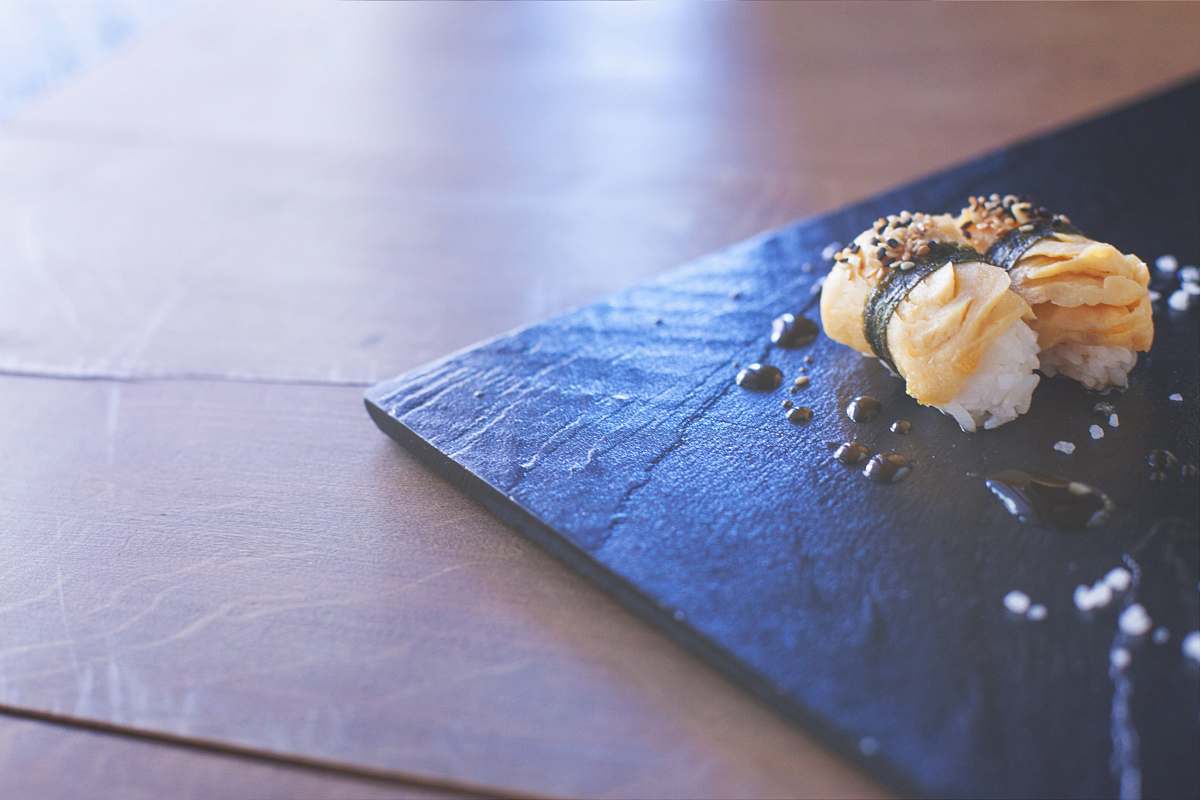 slate food on black plate rice
