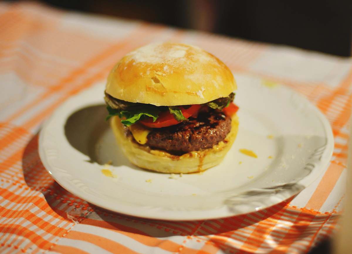 burger food photography of meat burger with tomatoes and lettuce homemade