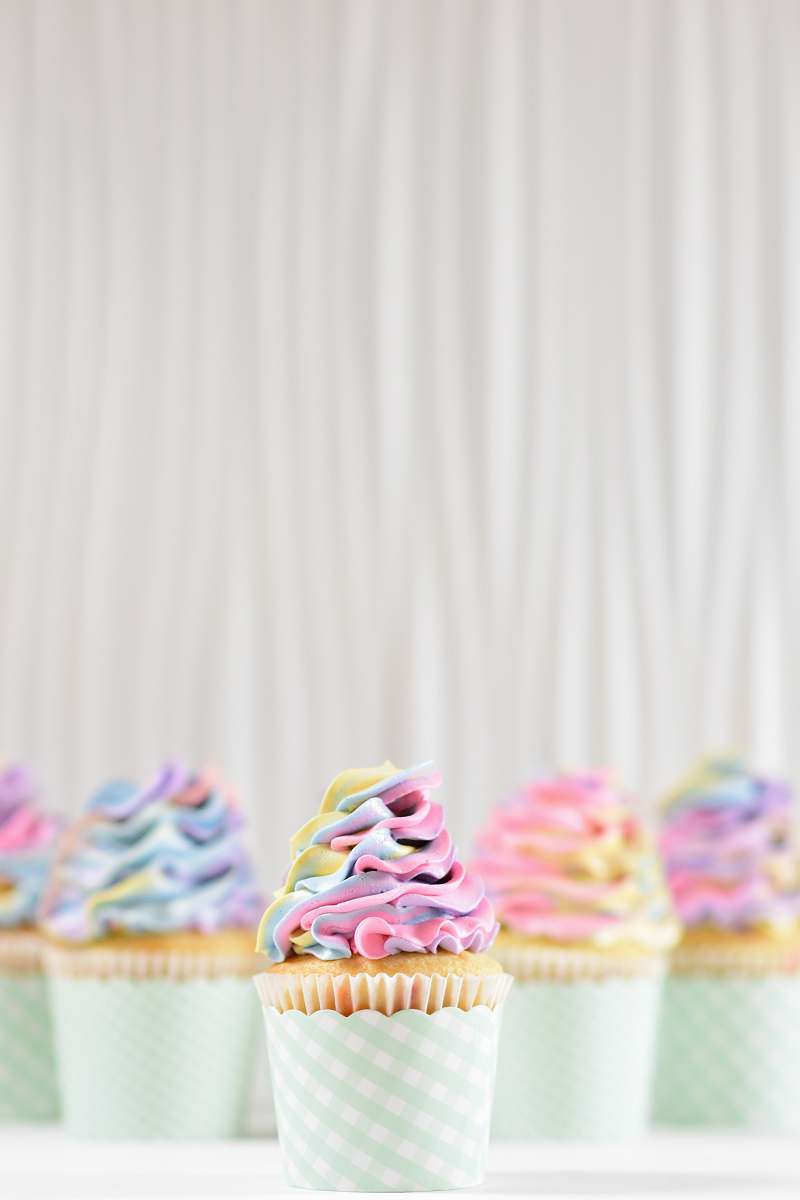 cream frosting on two cupcakes dessert