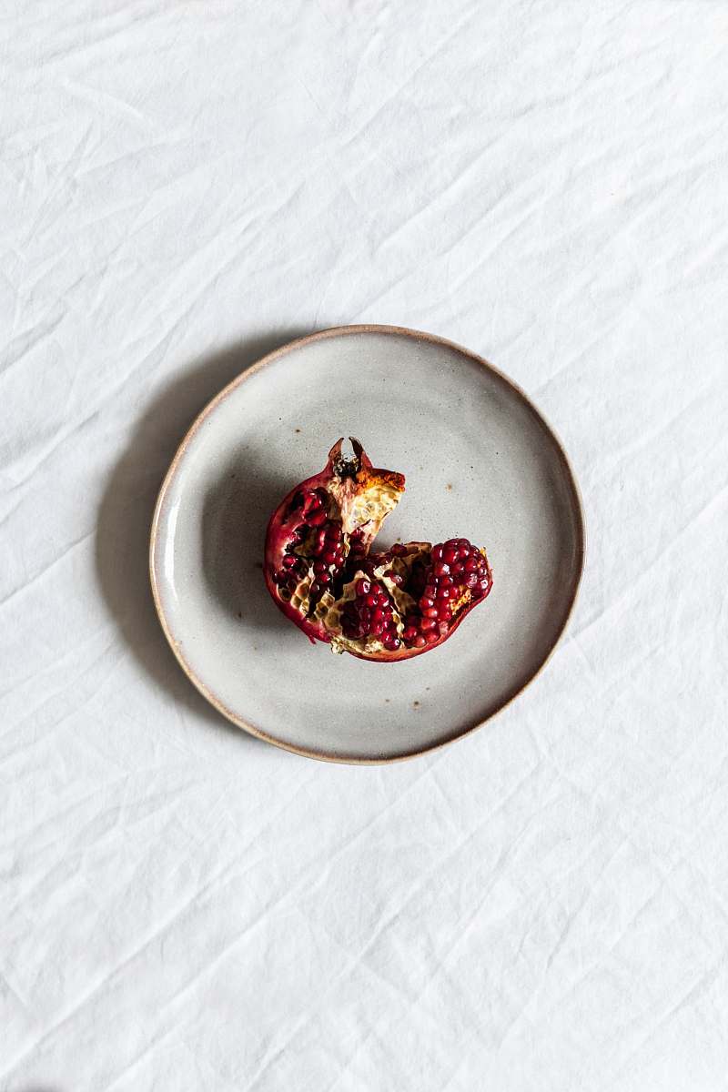 fruit fruit on white ceramic plate pomegranate