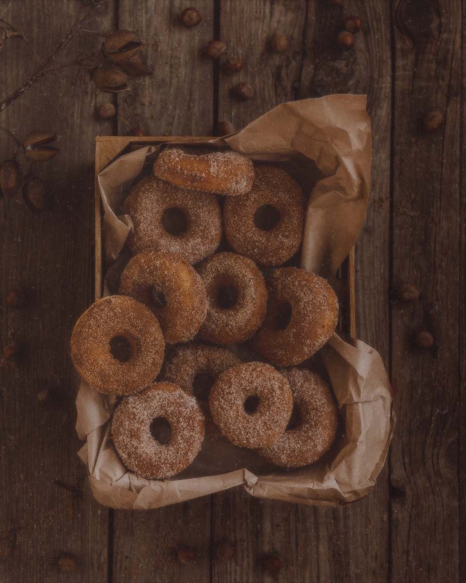 bread glazed donuts on brown tray bagel