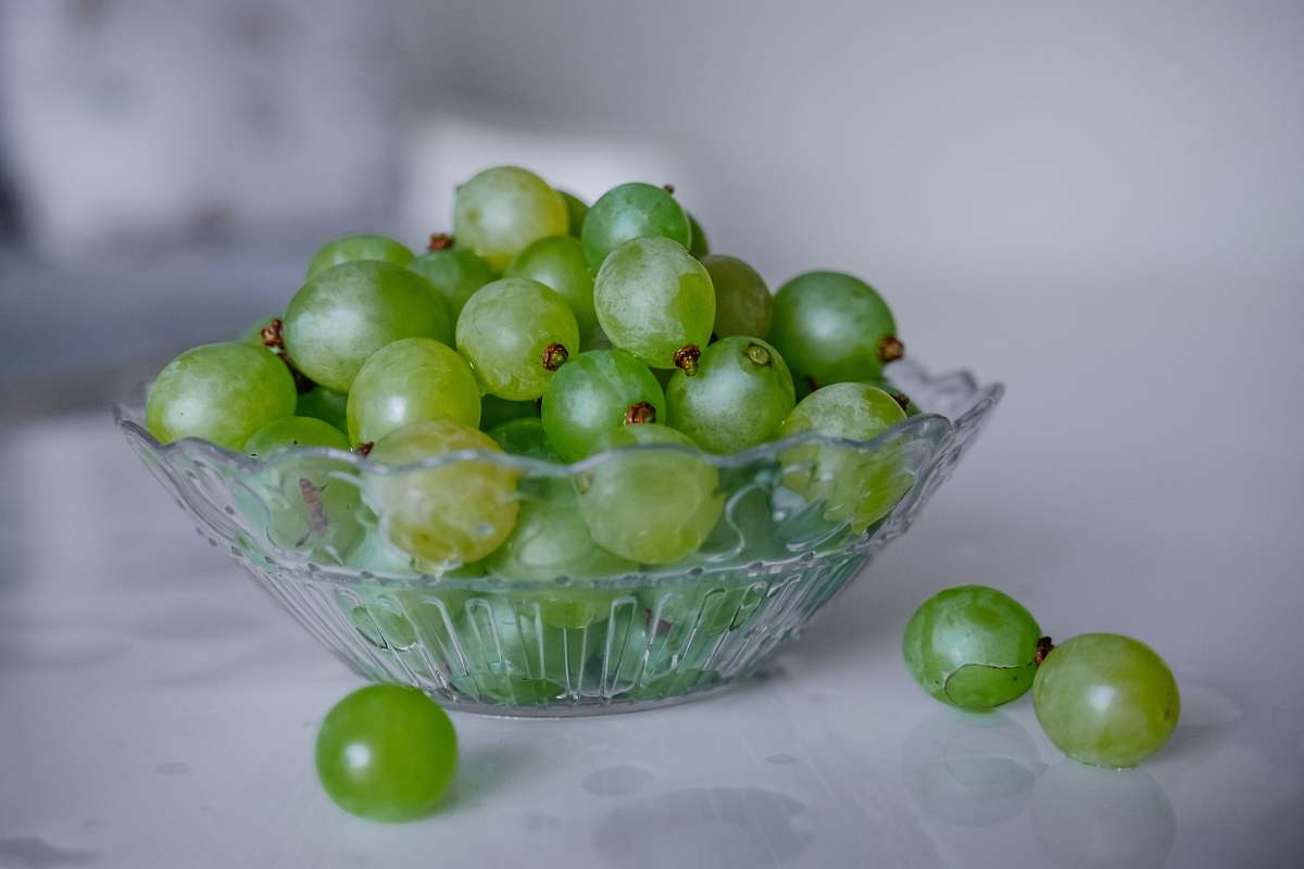 plant green grapes in clear glass bowl fruit