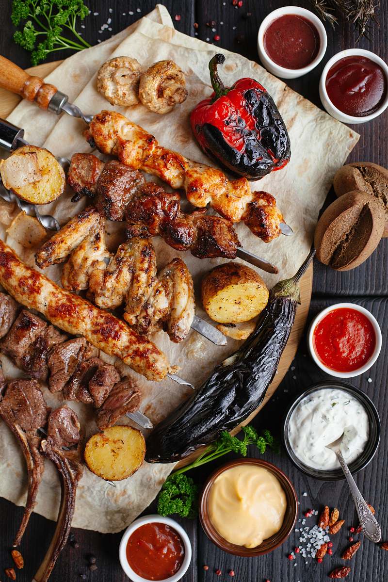 spoon grilled meat and vegetable on the table cutlery