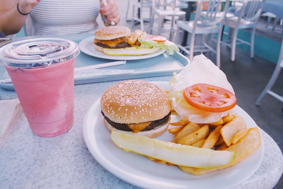 burger hamburger and potato fries meal on table chair