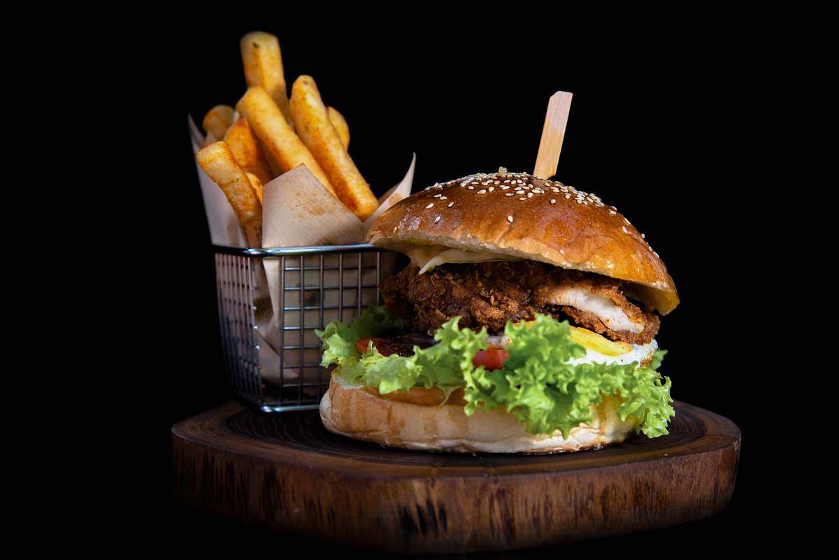 burger hamburger by french fries on board 