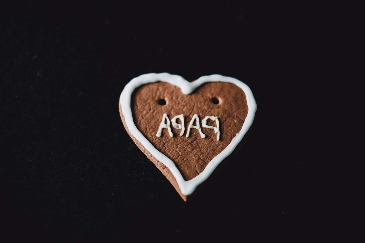 confectionery heart-shaped cookie with papa decoration sweets