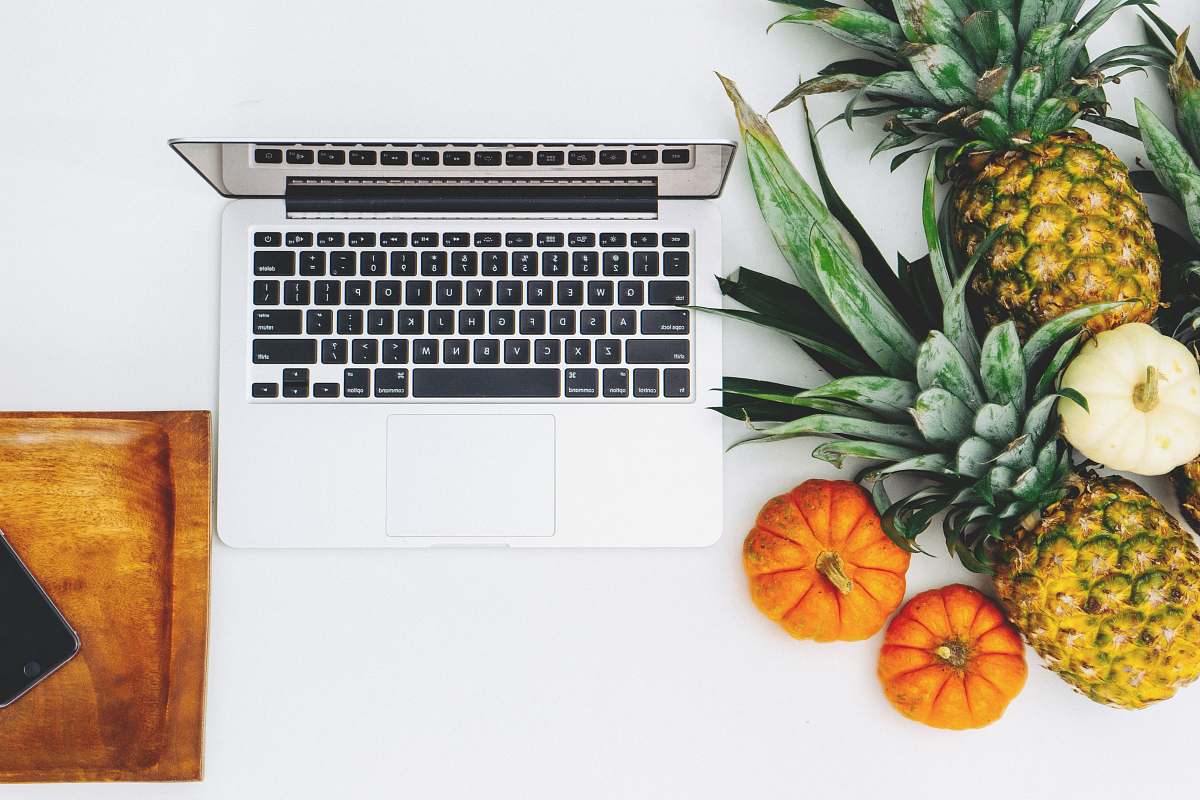 fruit MacBook Pro and assorted fruits flat lay photography pineapple